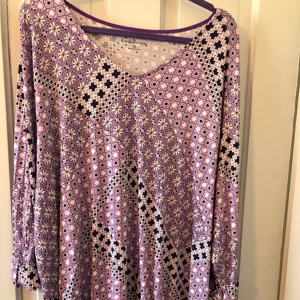 Purple/white patterned blouse.